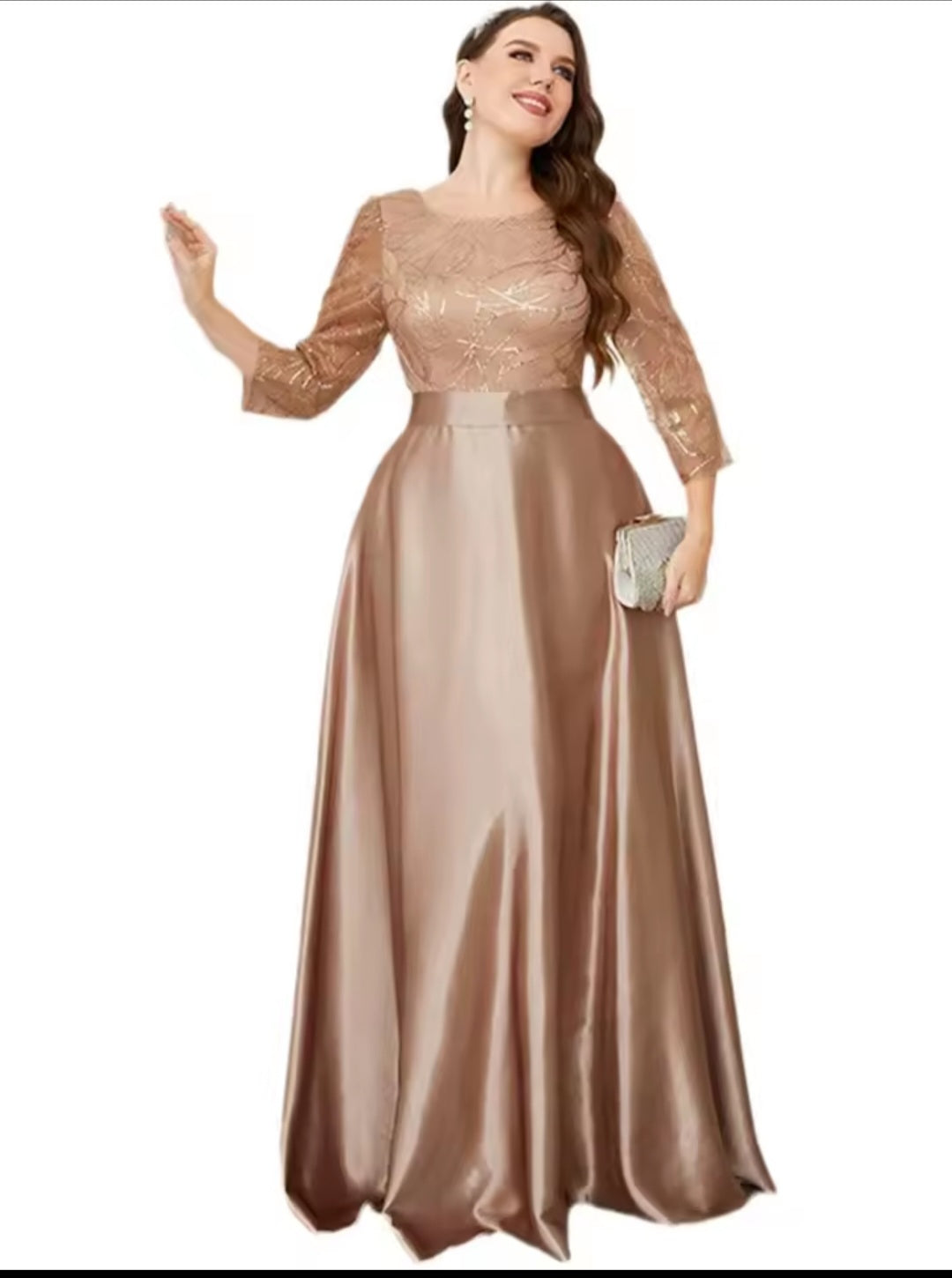 Woman wearing a long, elegant dress with lace sleeves on a white background