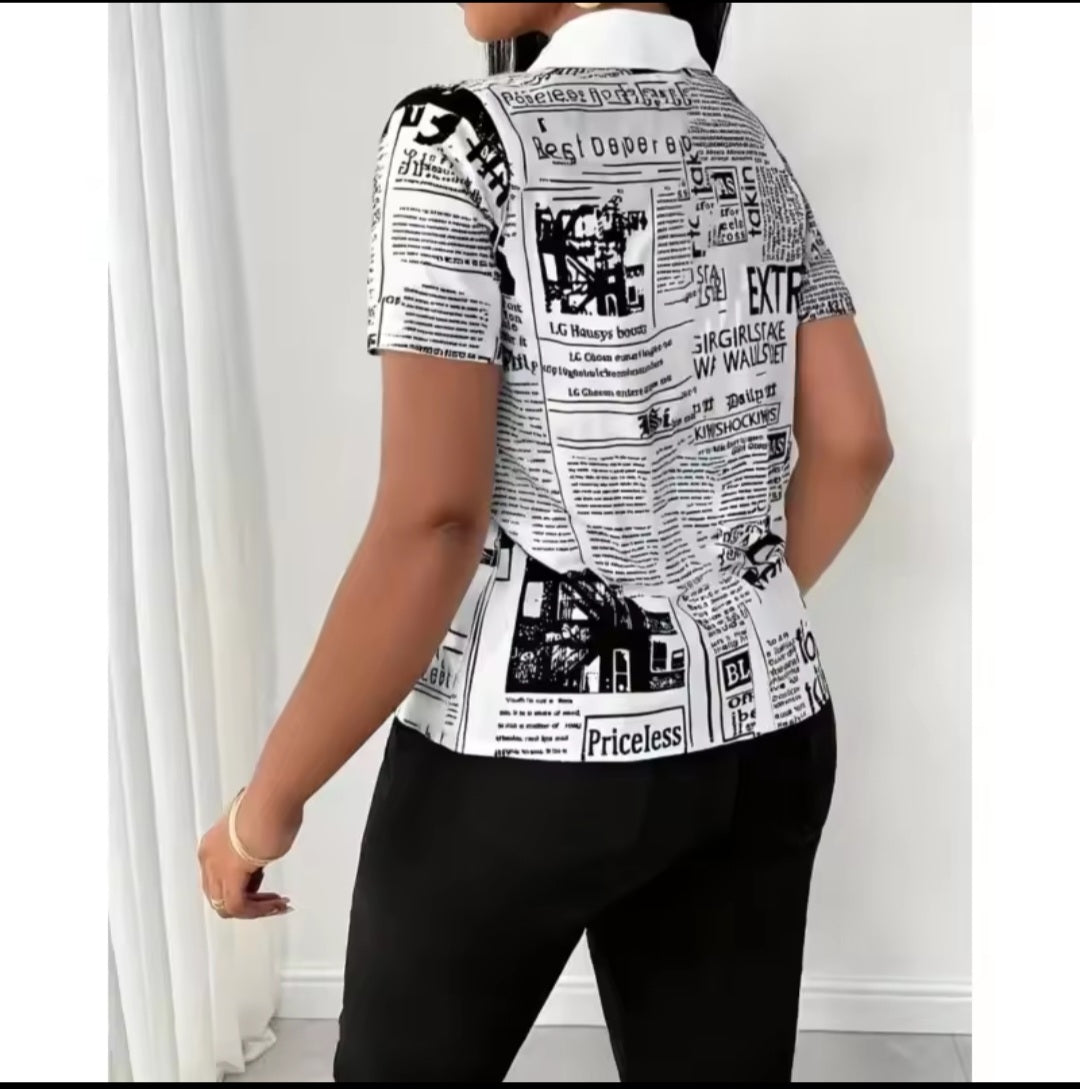 Person wearing a black and white newspaper print shirt against a white background