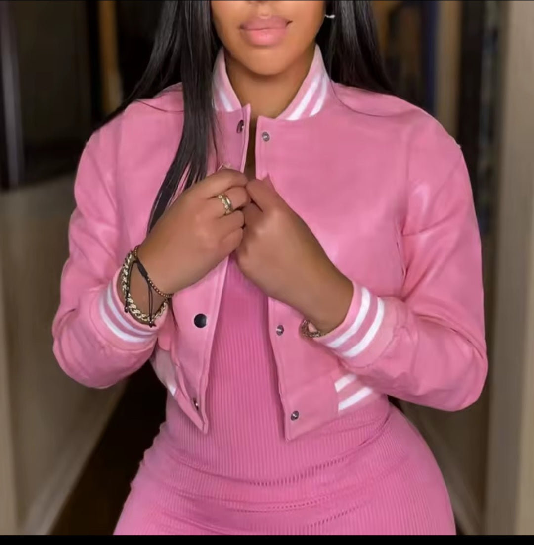 Person wearing a pink tracksuit with white accents