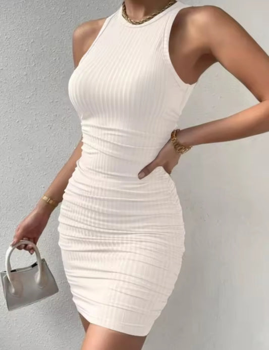White ribbed dress worn by a person against a gray background