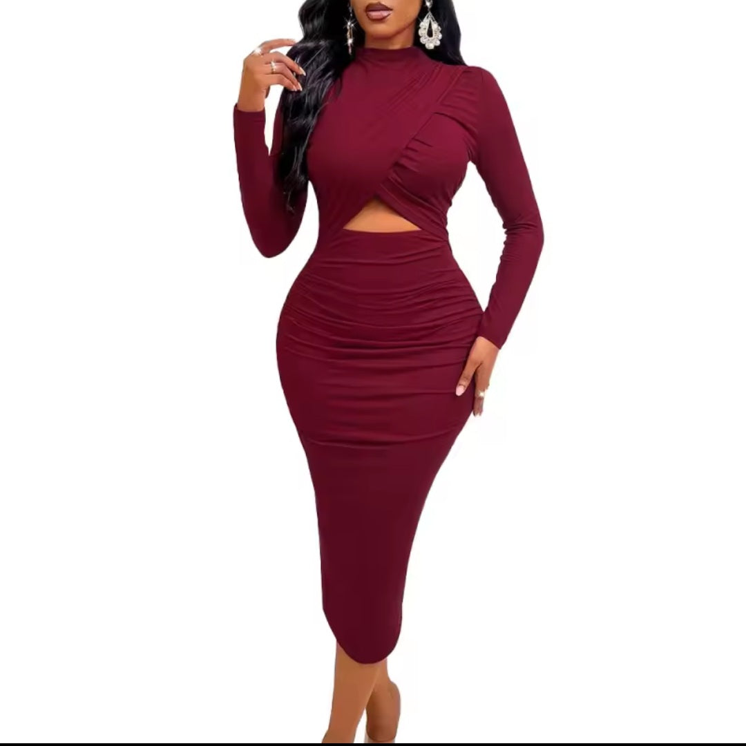 Burgundy two-piece dress with long sleeves and cutout design on a white background