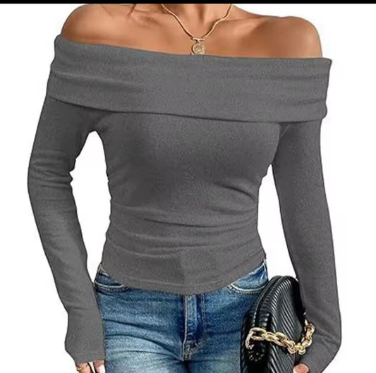 Gray off-shoulder top worn by a person on a white background