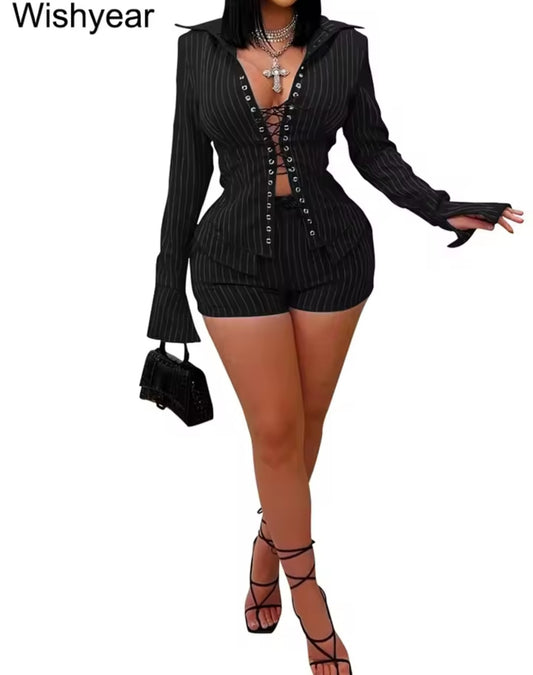 Black ribbed outfit with lace-up details on a white background, featuring the brand 'Wishyear'.