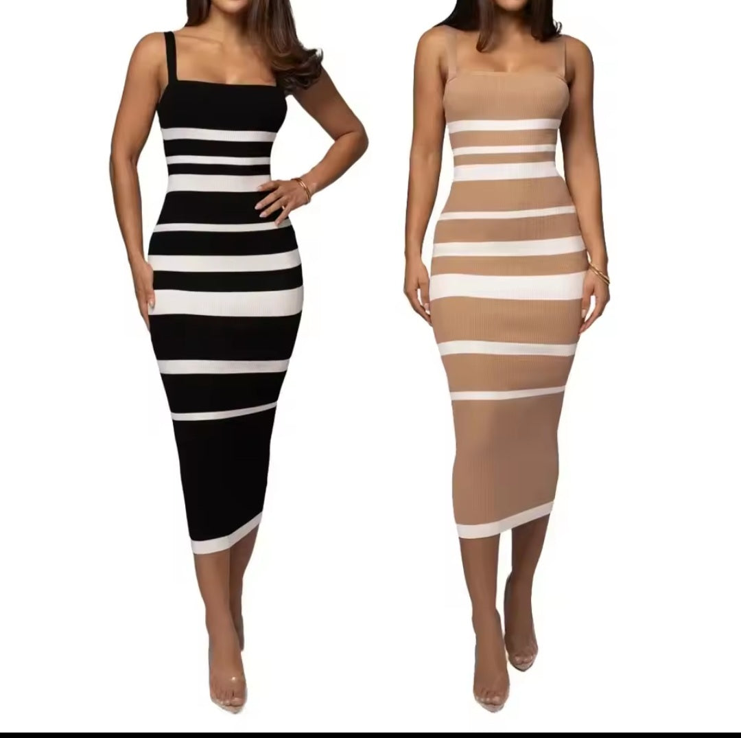 Two women wearing black and white striped and beige and white striped dresses on a white background.