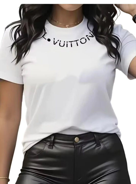 Person wearing a white t-shirt with 'Louis Vuitton' logo and black leather pants.