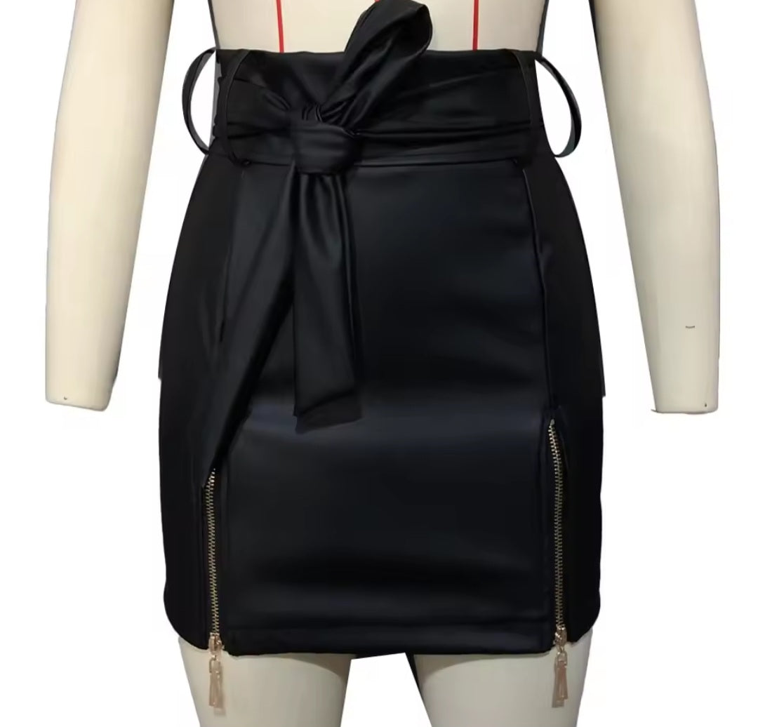 Black skirt with a bow on a mannequin against a white background
