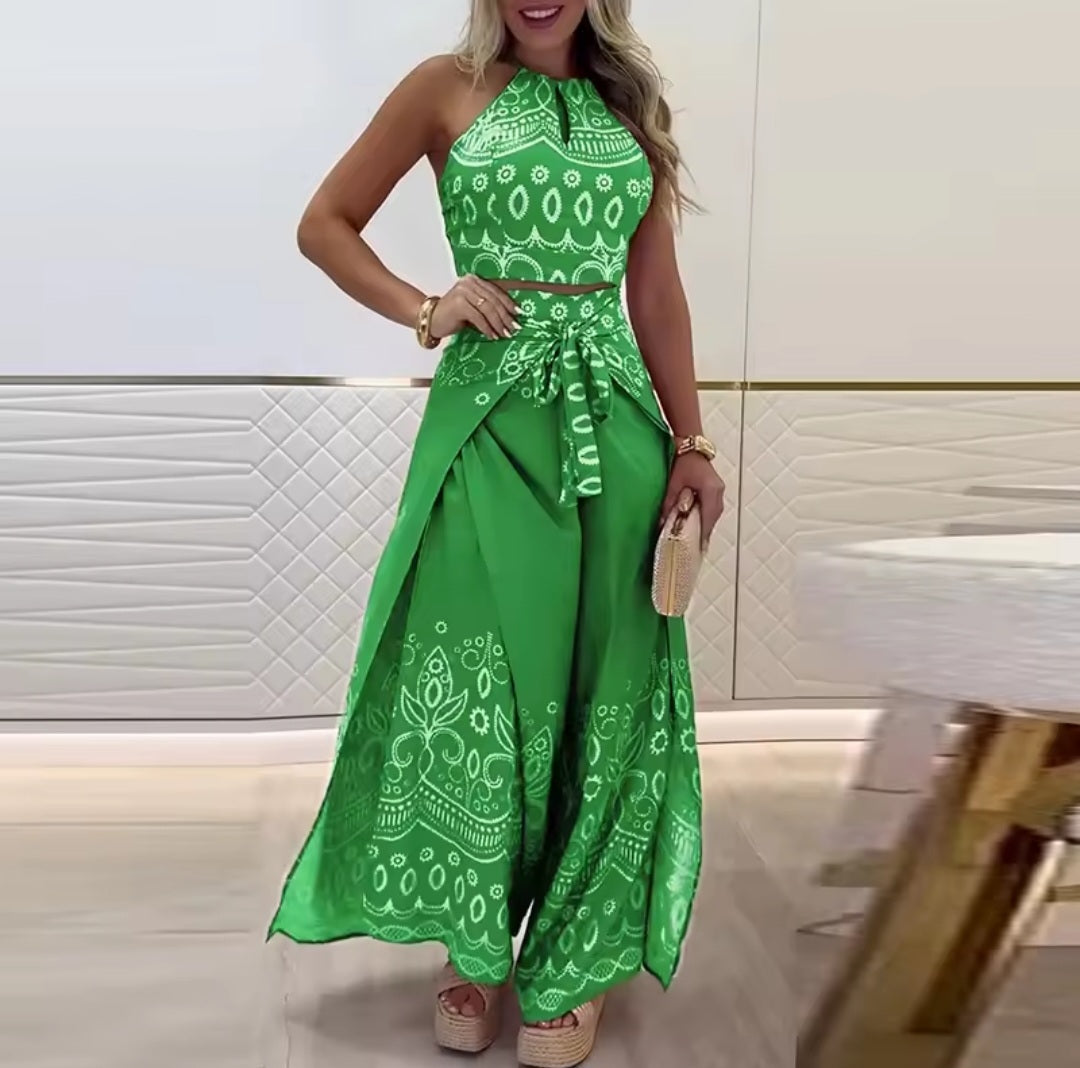 Woman wearing a green patterned outfit in an indoor setting