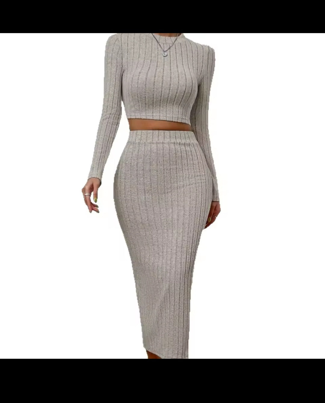 Two-piece ribbed knit outfit with long-sleeve top and pencil skirt on a white background