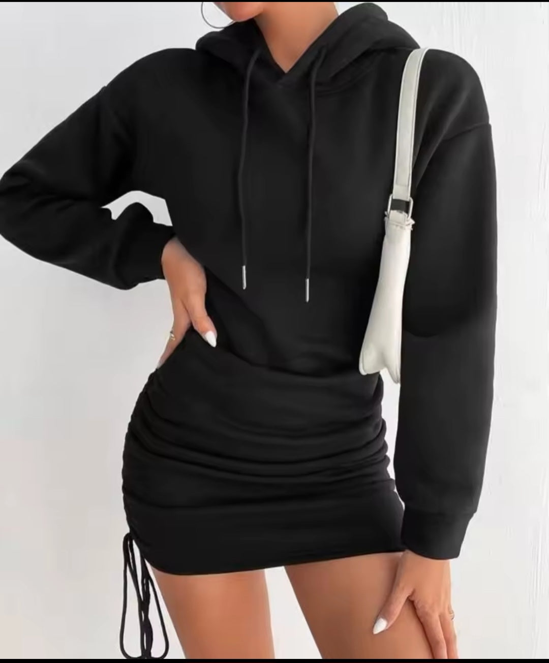 Black hoodie dress worn by a person on a white background