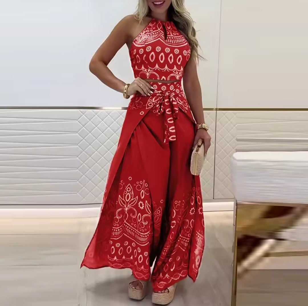 Woman wearing a red patterned outfit in a bathroom setting