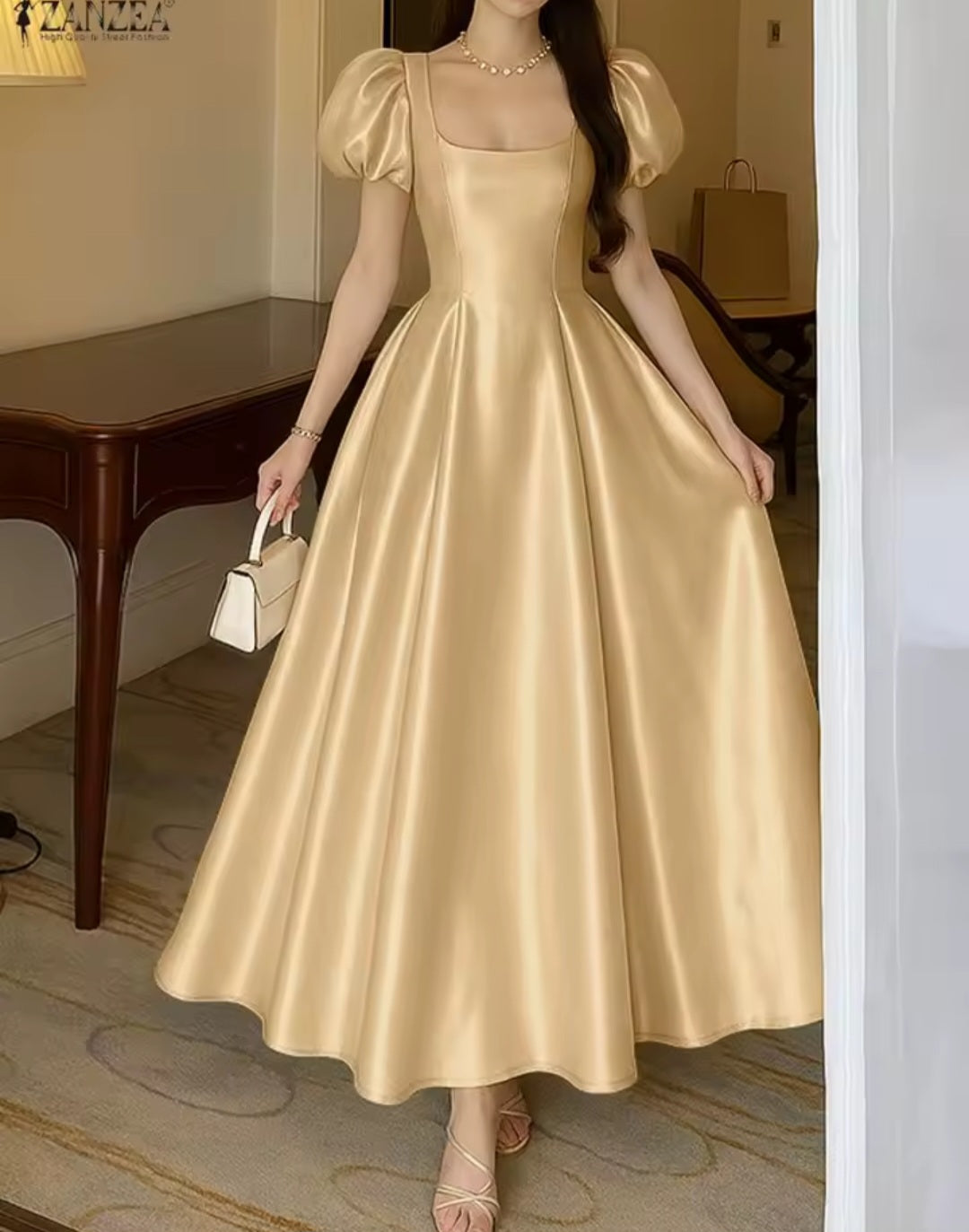 Woman wearing a gold satin dress in an indoor setting