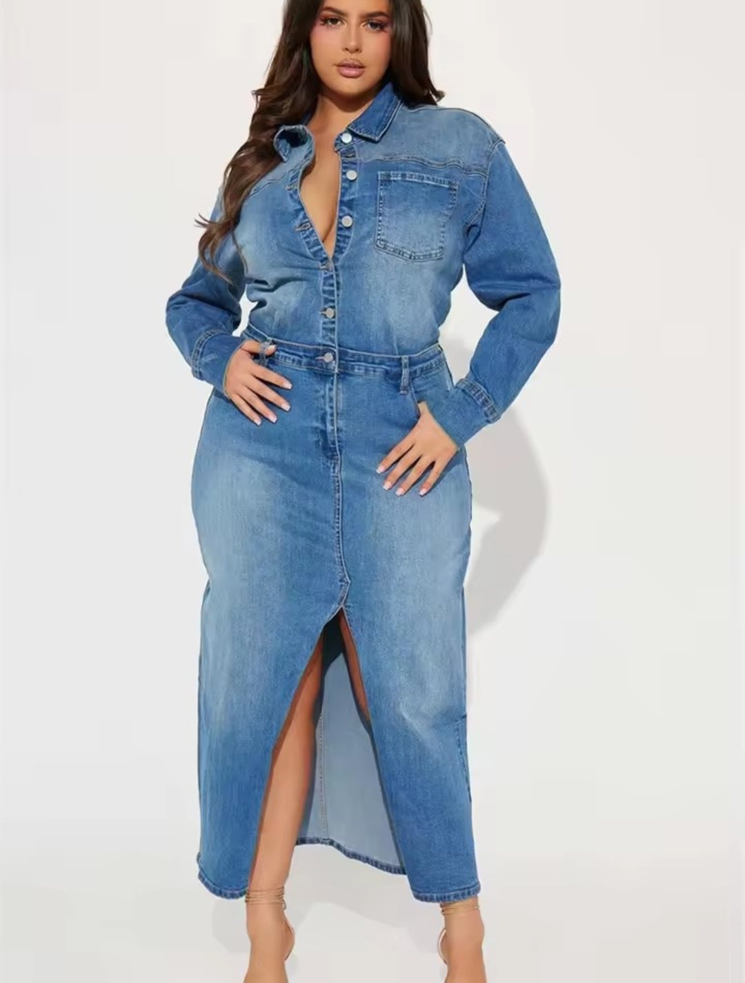 Woman wearing a blue denim dress on a white background