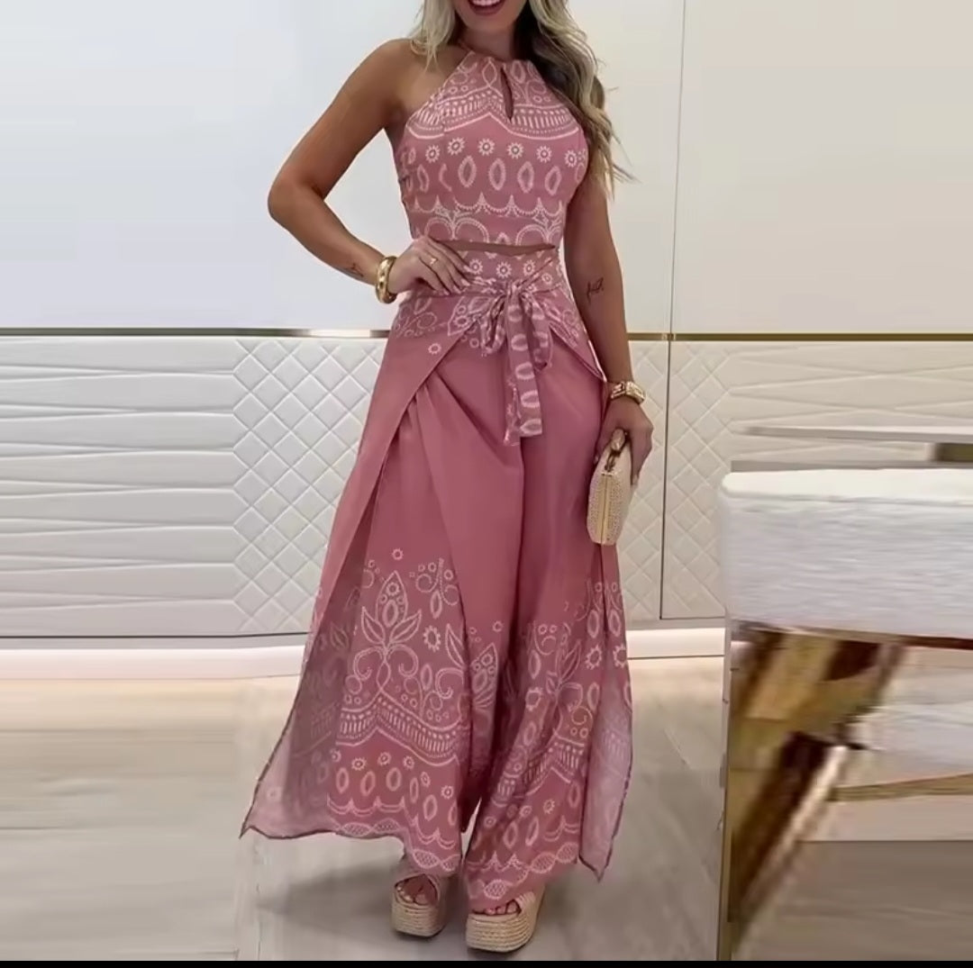 Woman wearing a pink patterned dress in an indoor setting