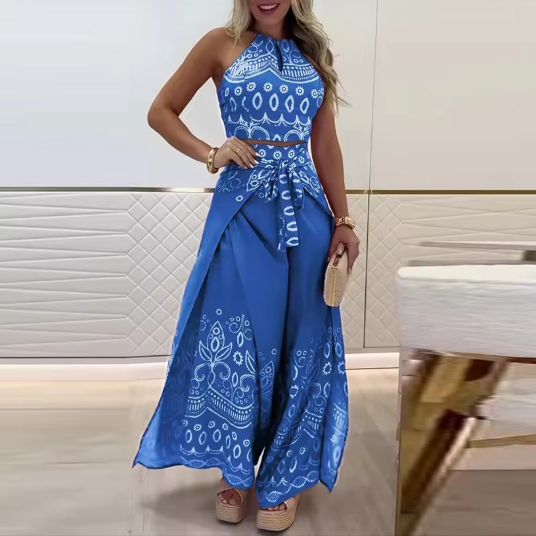 Woman wearing a blue patterned dress with a white background