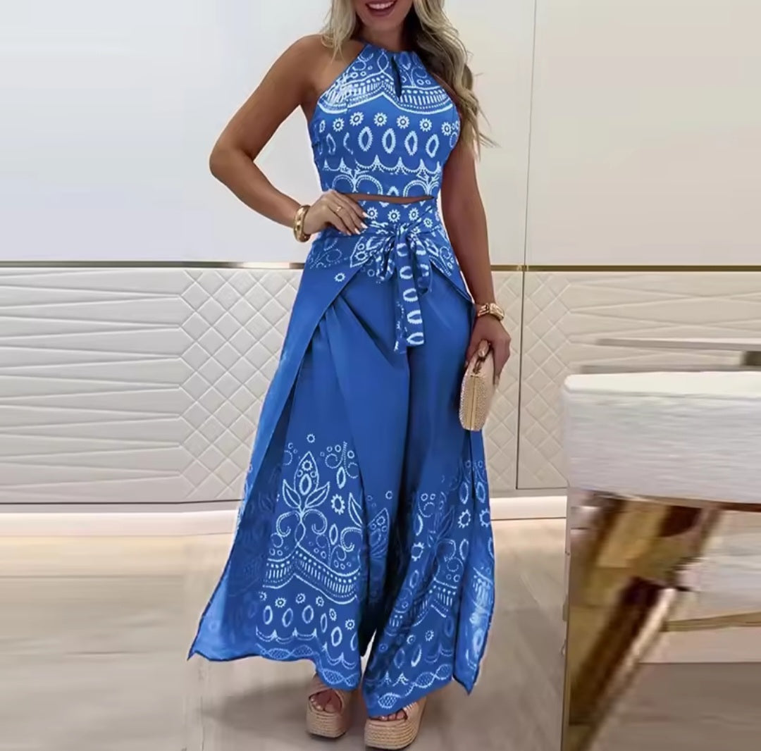 Woman wearing a blue patterned dress in an indoor setting