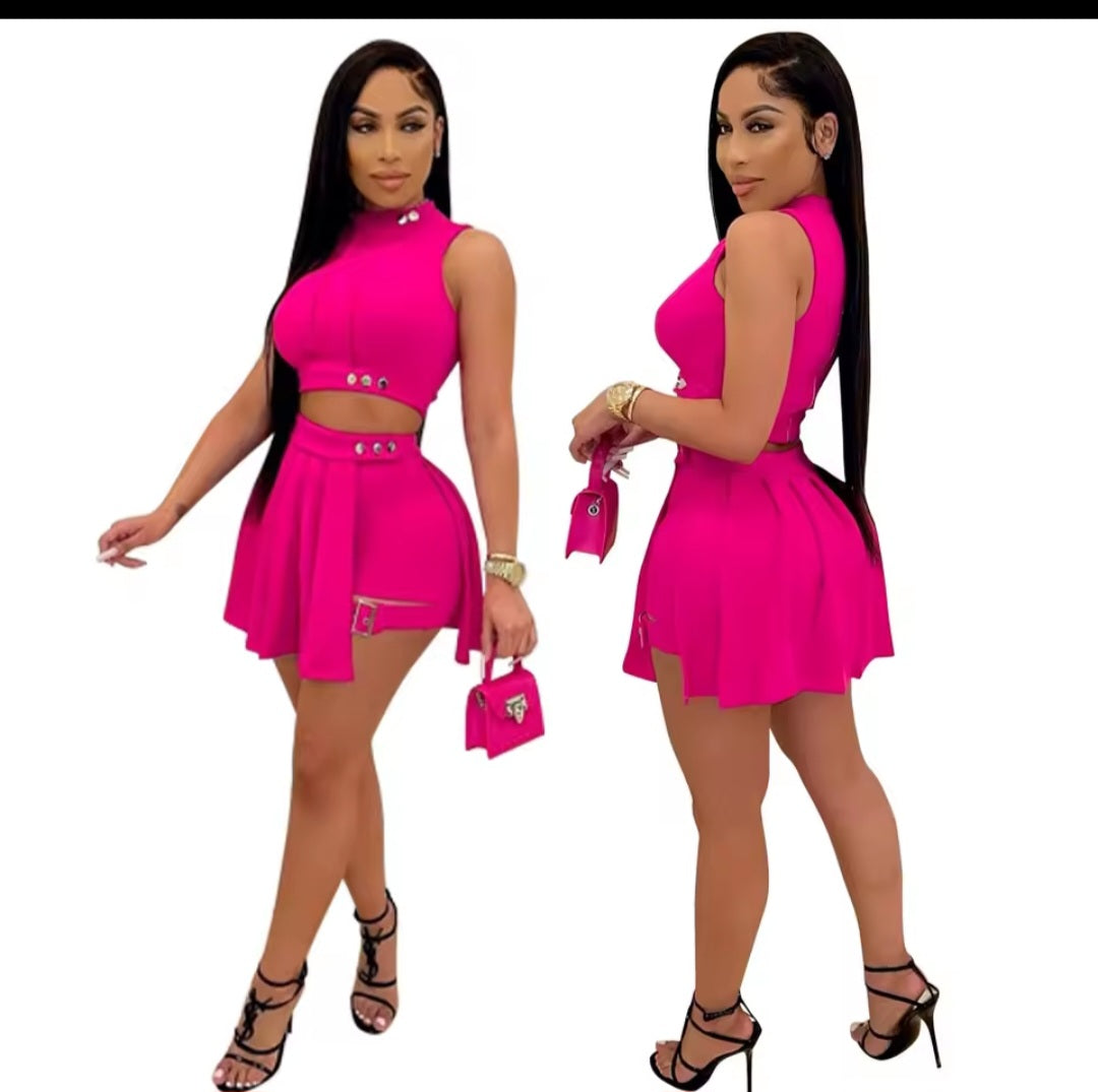 Two views of a woman wearing a bright pink outfit with a matching handbag on a white background.