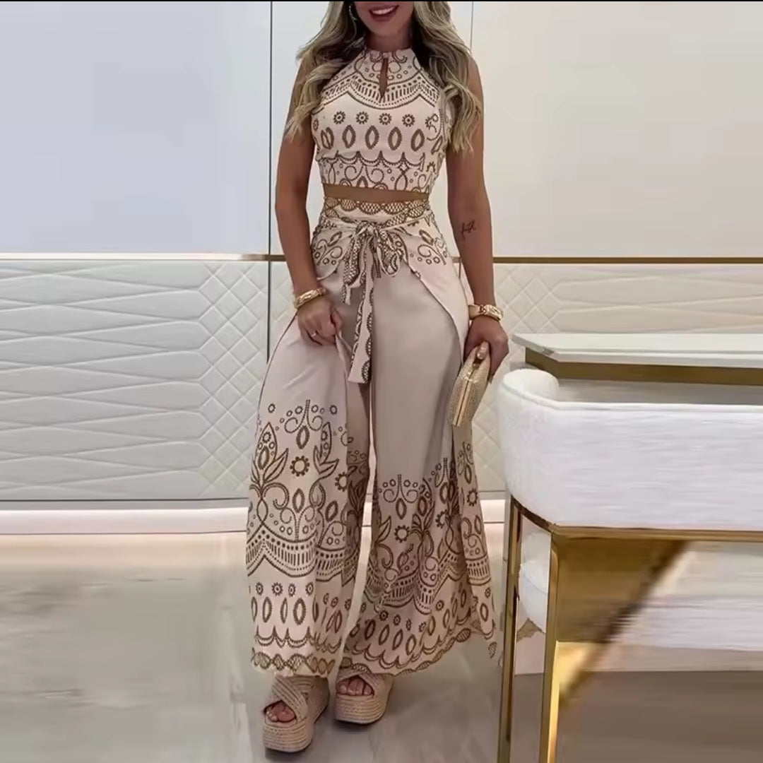Woman wearing a beige and brown patterned jumpsuit in an indoor setting.