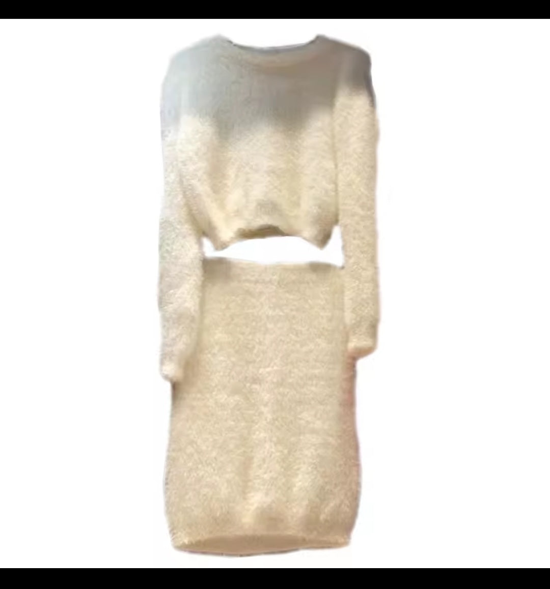 Two-tone cream sweater set on a white background