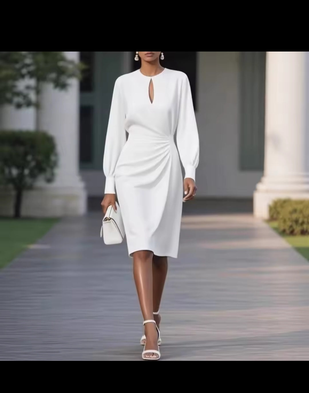 Woman in a white dress walking outdoors with classical architecture in the background