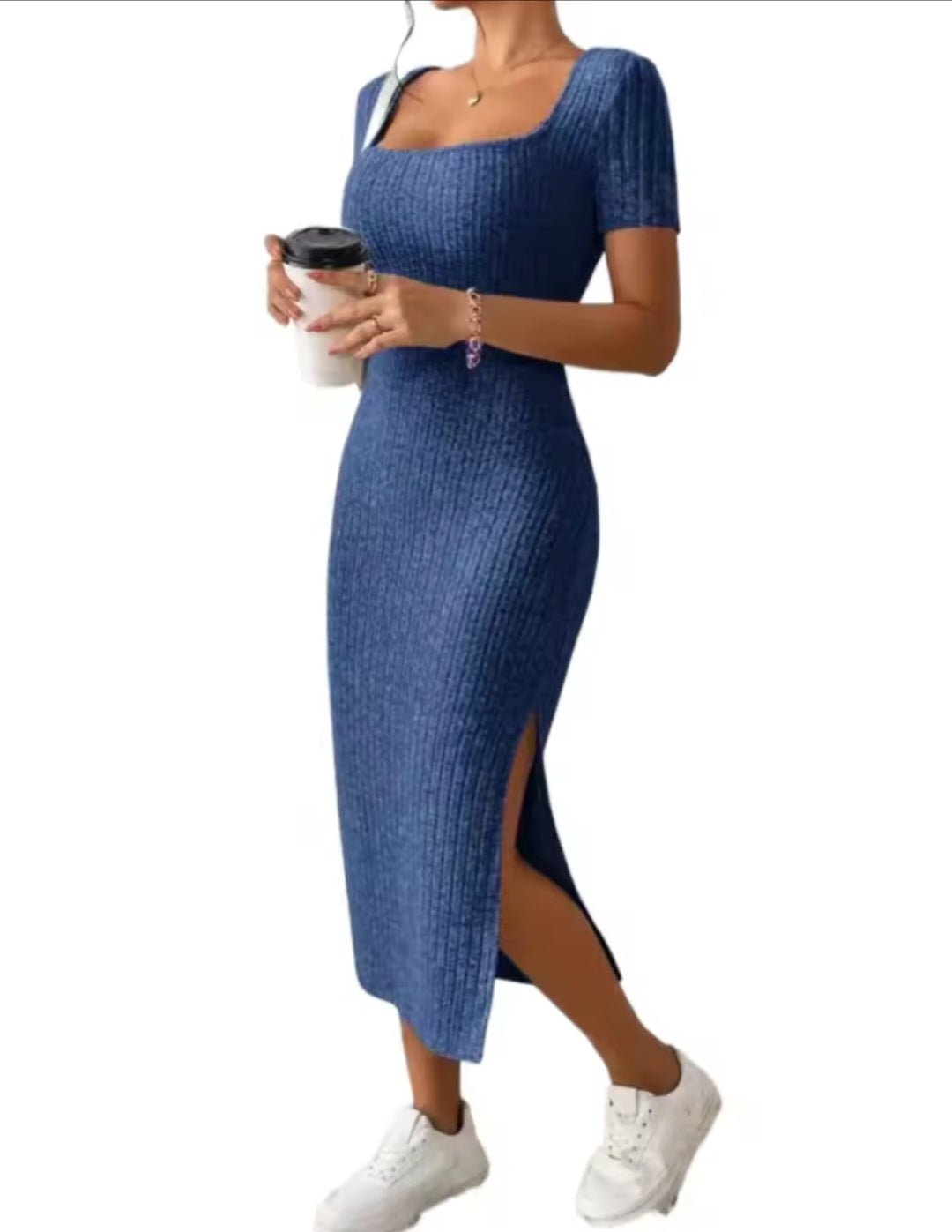 Woman wearing a blue dress with a white background