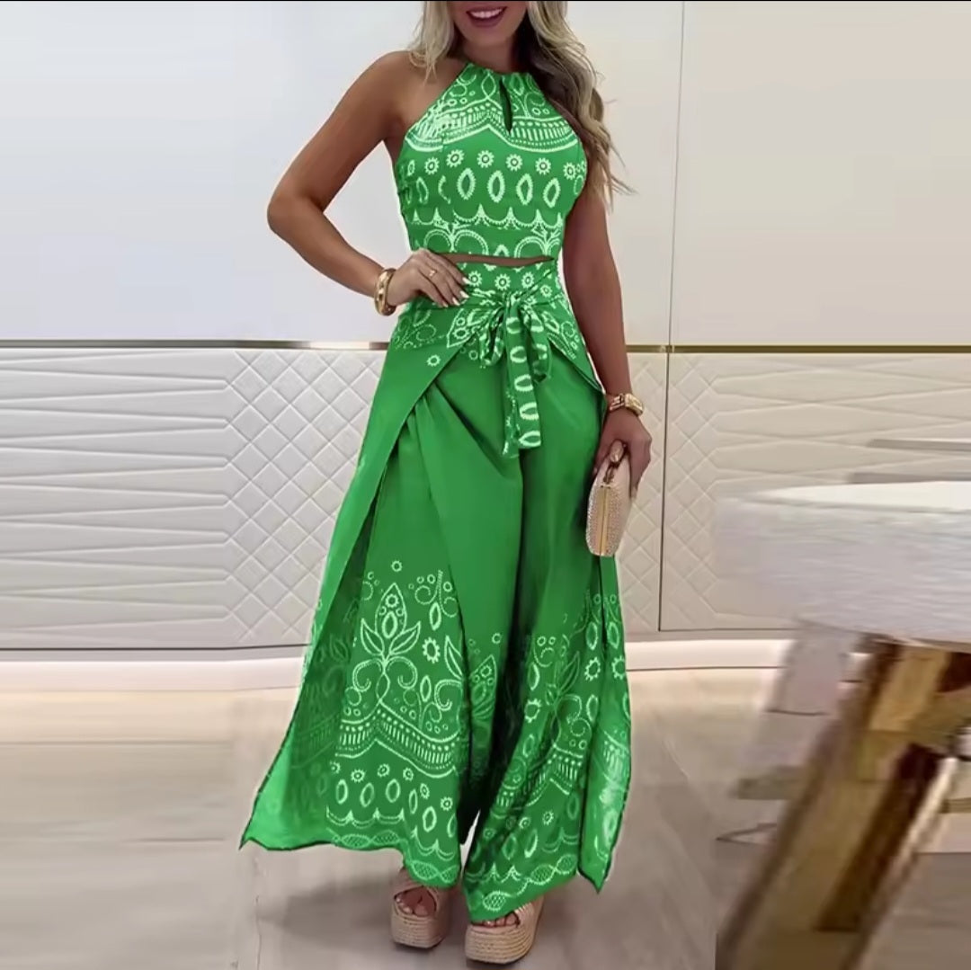 Woman wearing a green patterned outfit in an indoor setting