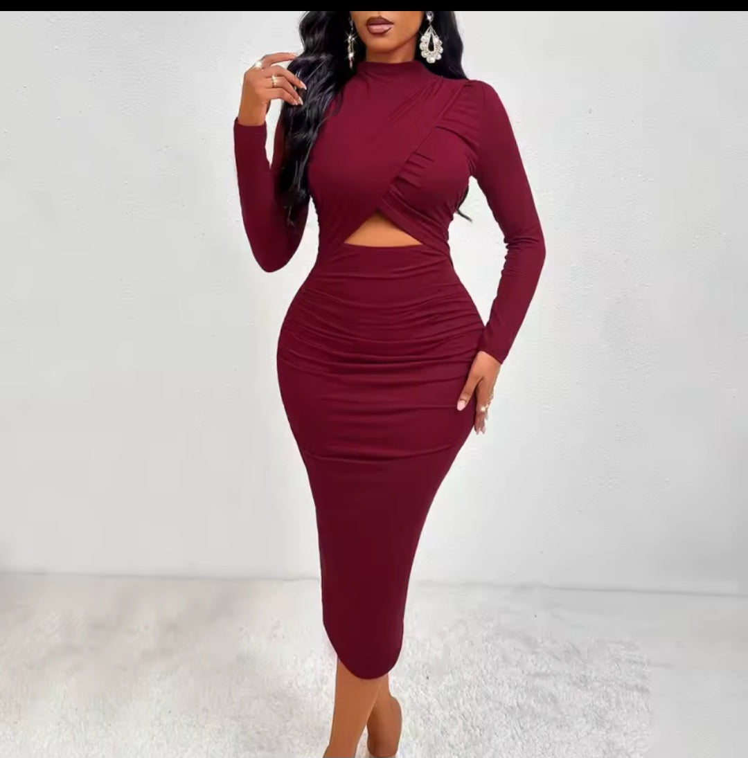 Burgundy two-piece dress with long sleeves and cutout design on a white background