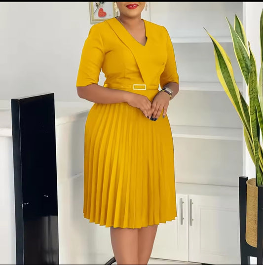 Woman wearing a yellow dress in a kitchen setting