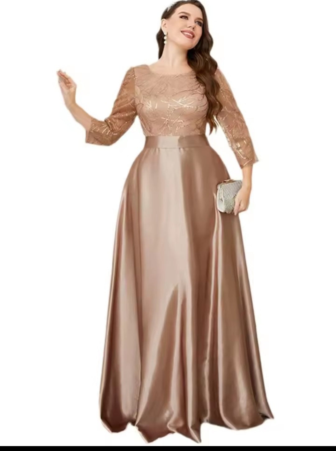 Woman wearing a long, elegant dress with lace top and satin skirt on a white background