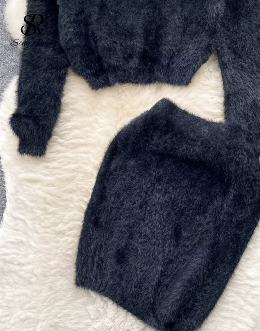 Dark blue textured fabric on a white surface