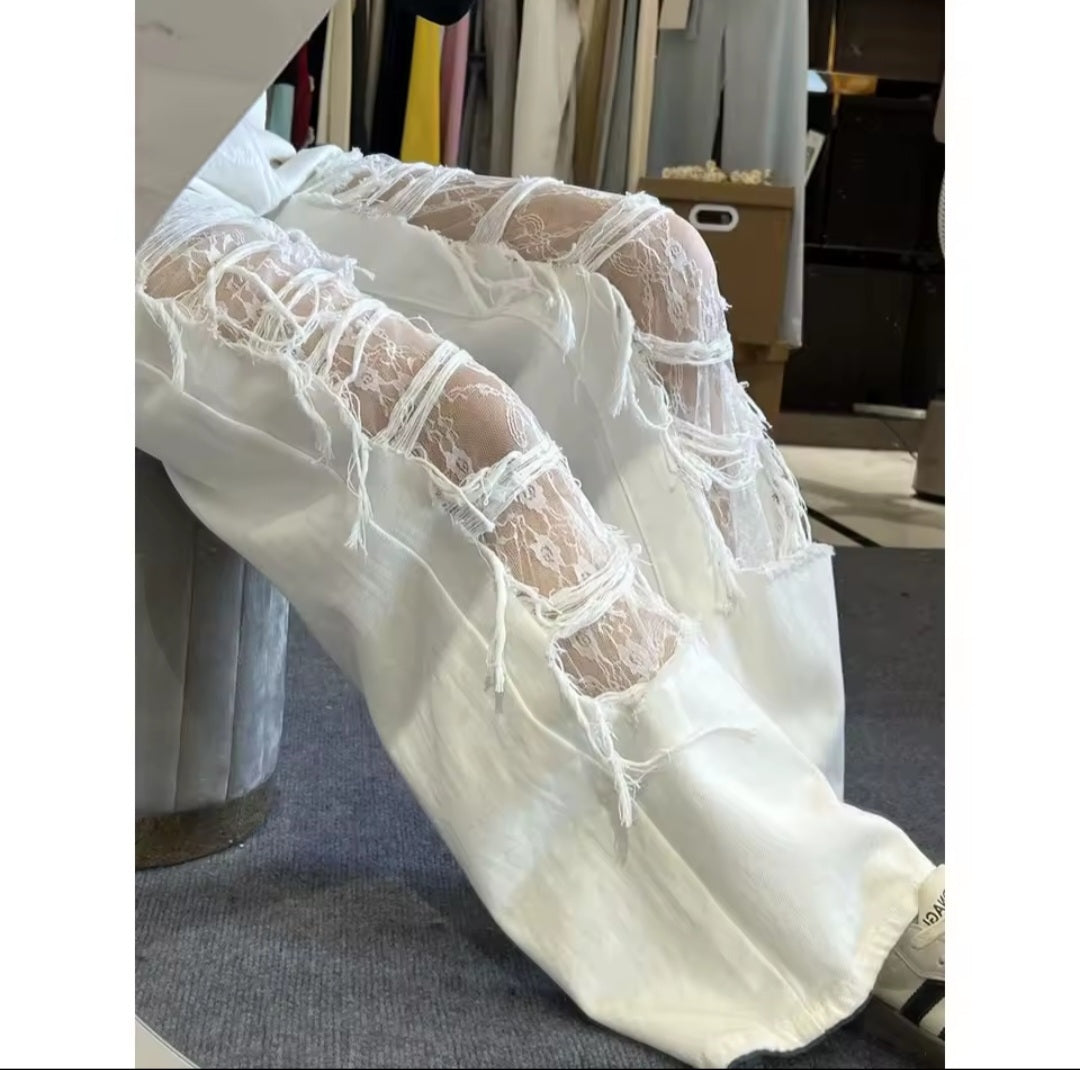 White lace-trimmed garment on a chair with a blurred background