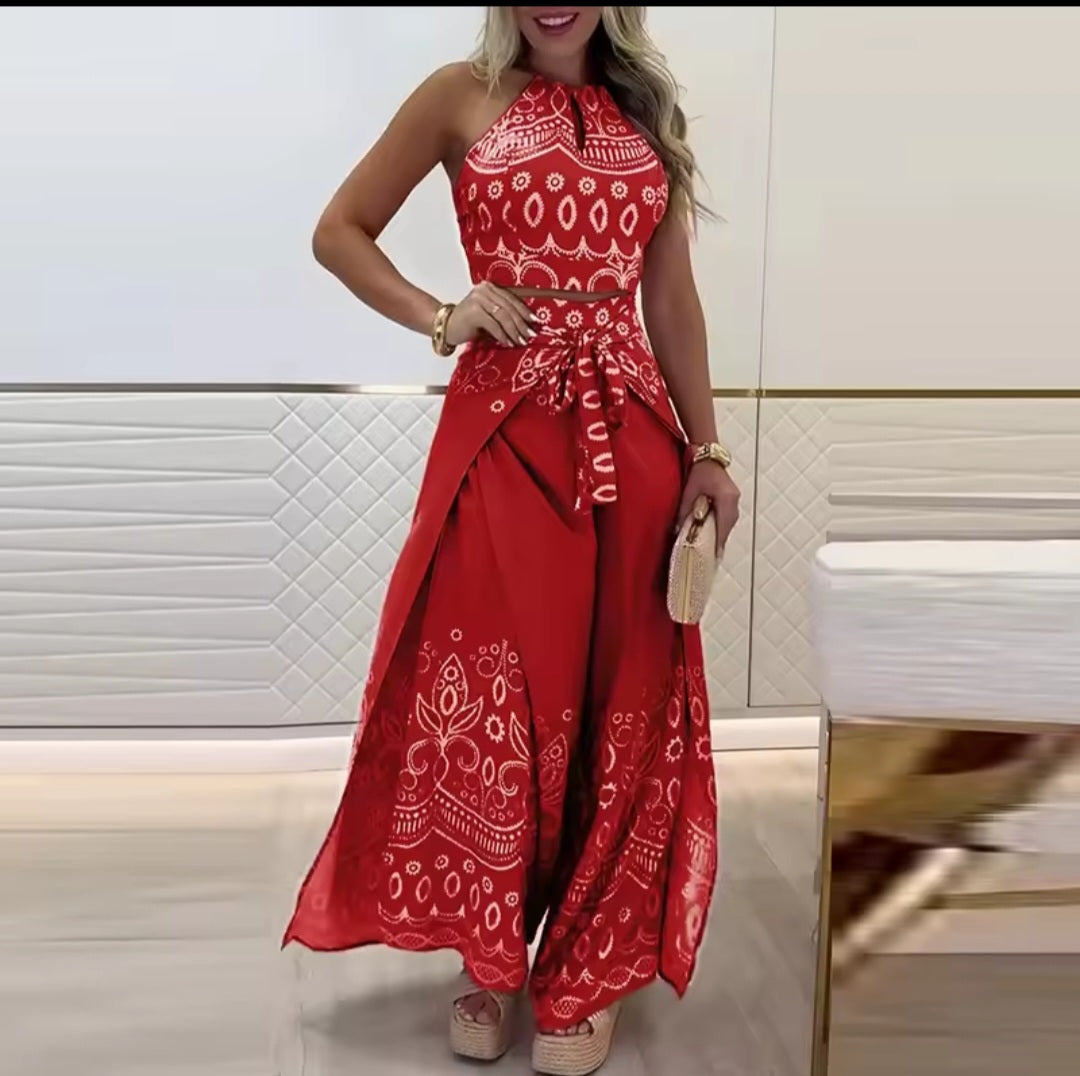 Woman wearing a red outfit with white patterns in an indoor setting