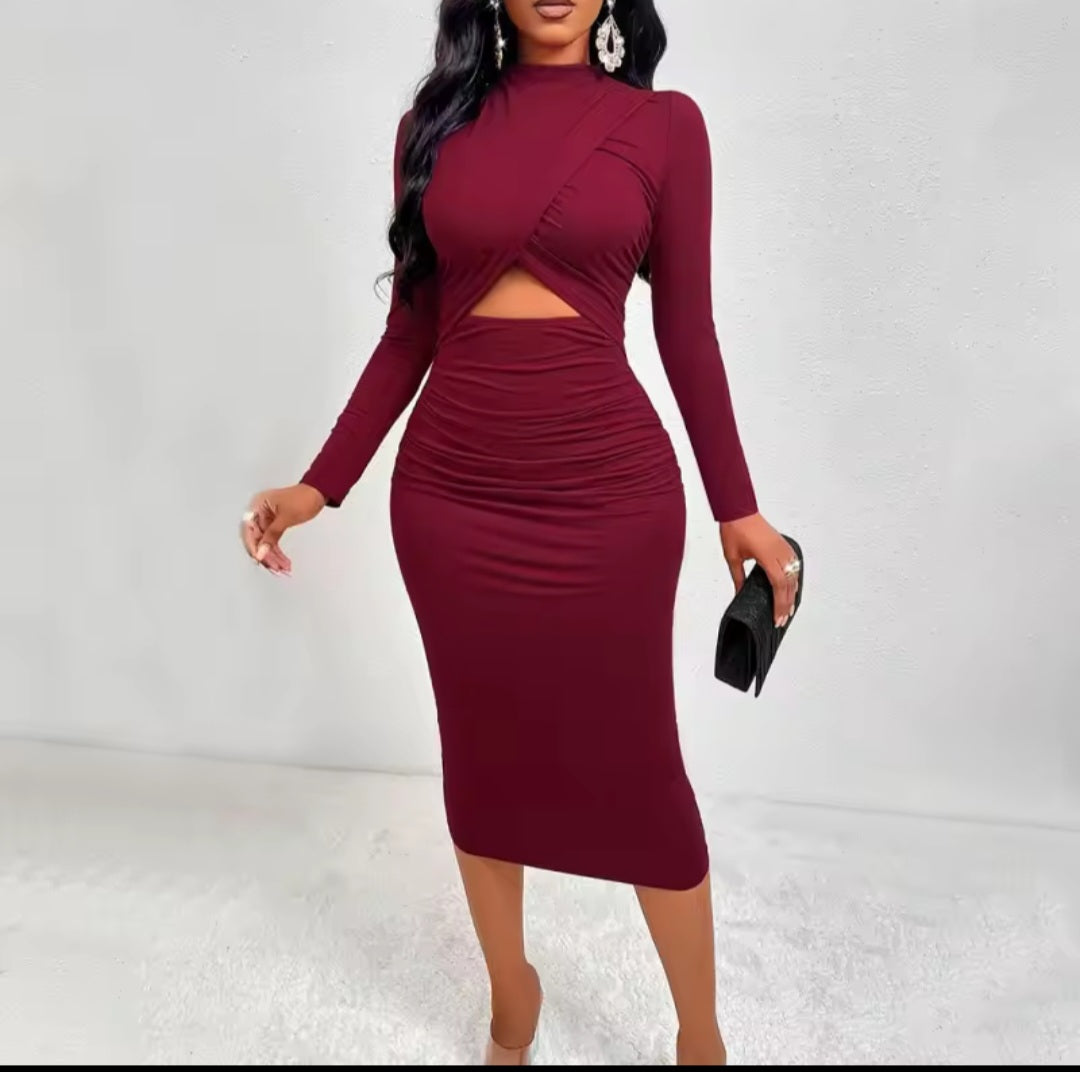 Burgundy dress with long sleeves and cut-out design on a white background