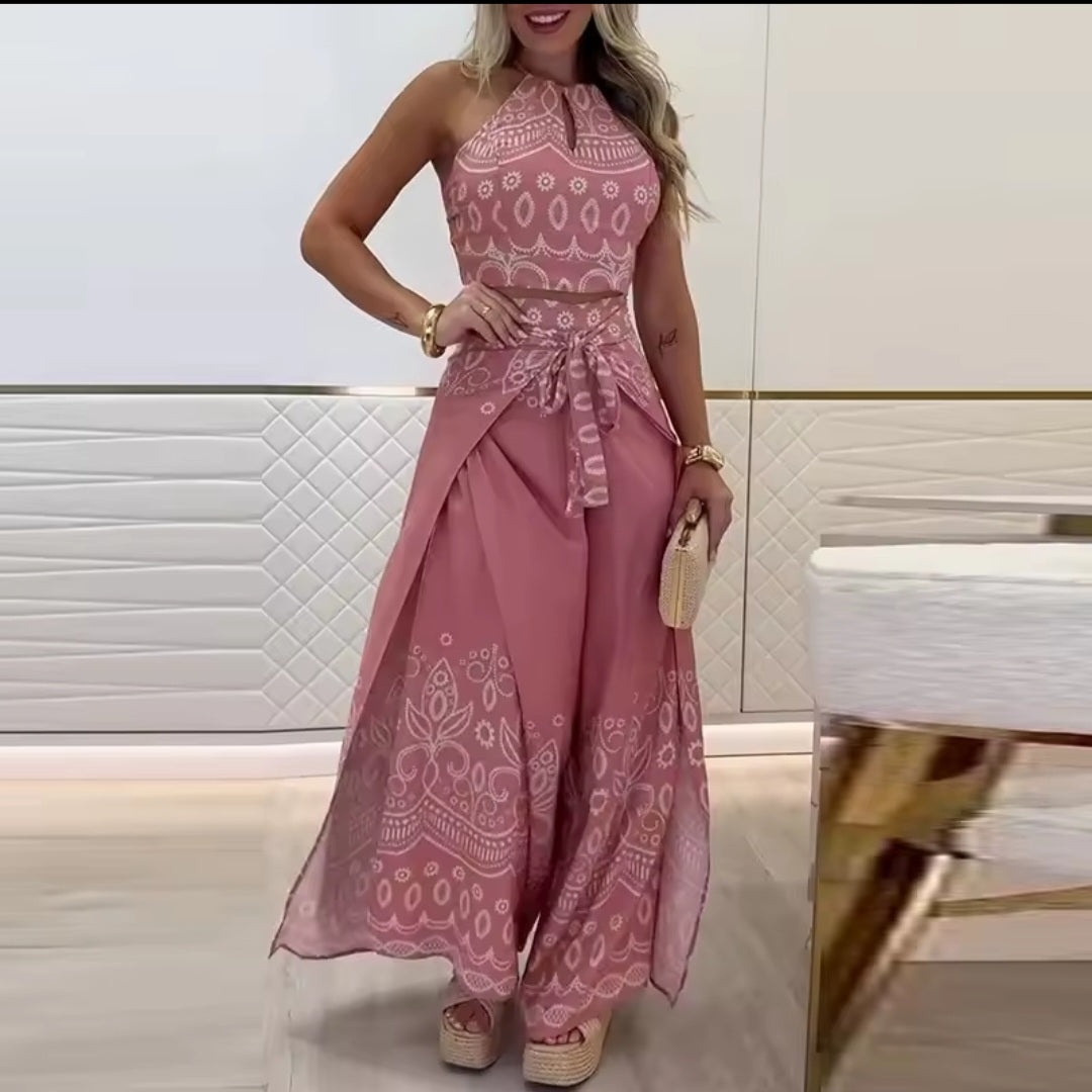 Woman wearing a pink patterned dress in an indoor setting