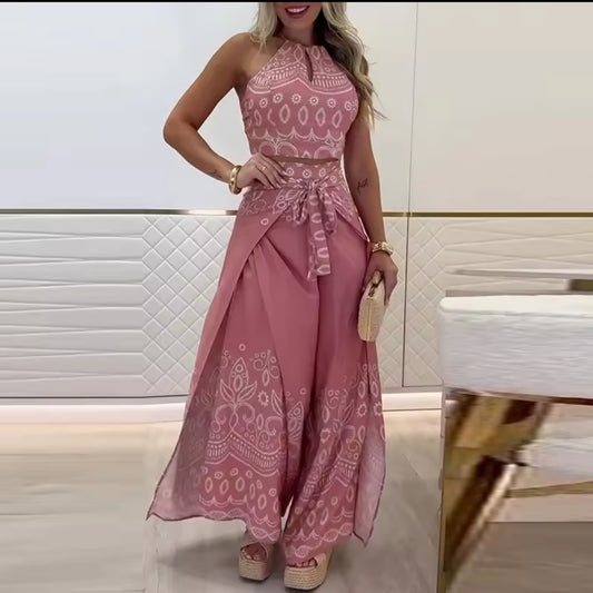 Woman wearing a pink patterned dress in an indoor setting