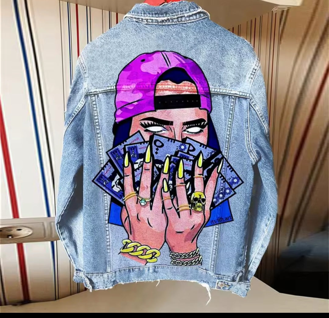 Denim jacket with a graphic design of hands holding tarot cards and a purple cap.